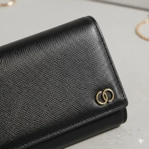 Close-up showing the rich, textured material of the black female wallet exterior.