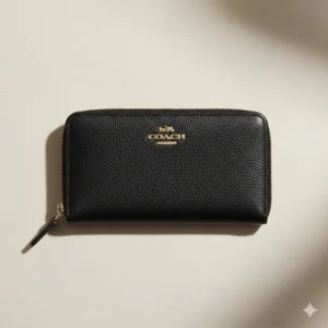 Minimalist coach medium zip wallet crafted in durable black polished pebbled leather.