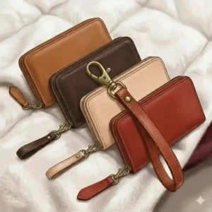 A row of handmade leather wristlets displayed in various colors including brown, black, red, and navy blue